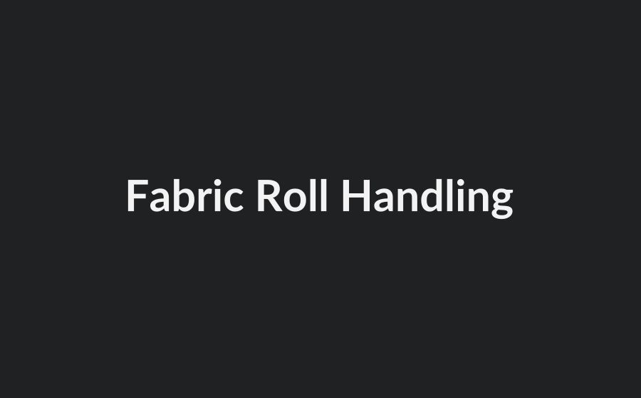 Conveyor and shuttle handling system for fabric rolls